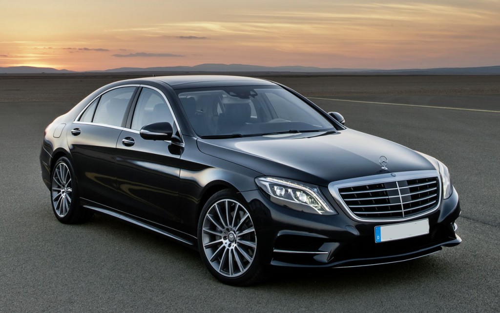 Black Mercedes S-Class sedan at sunset